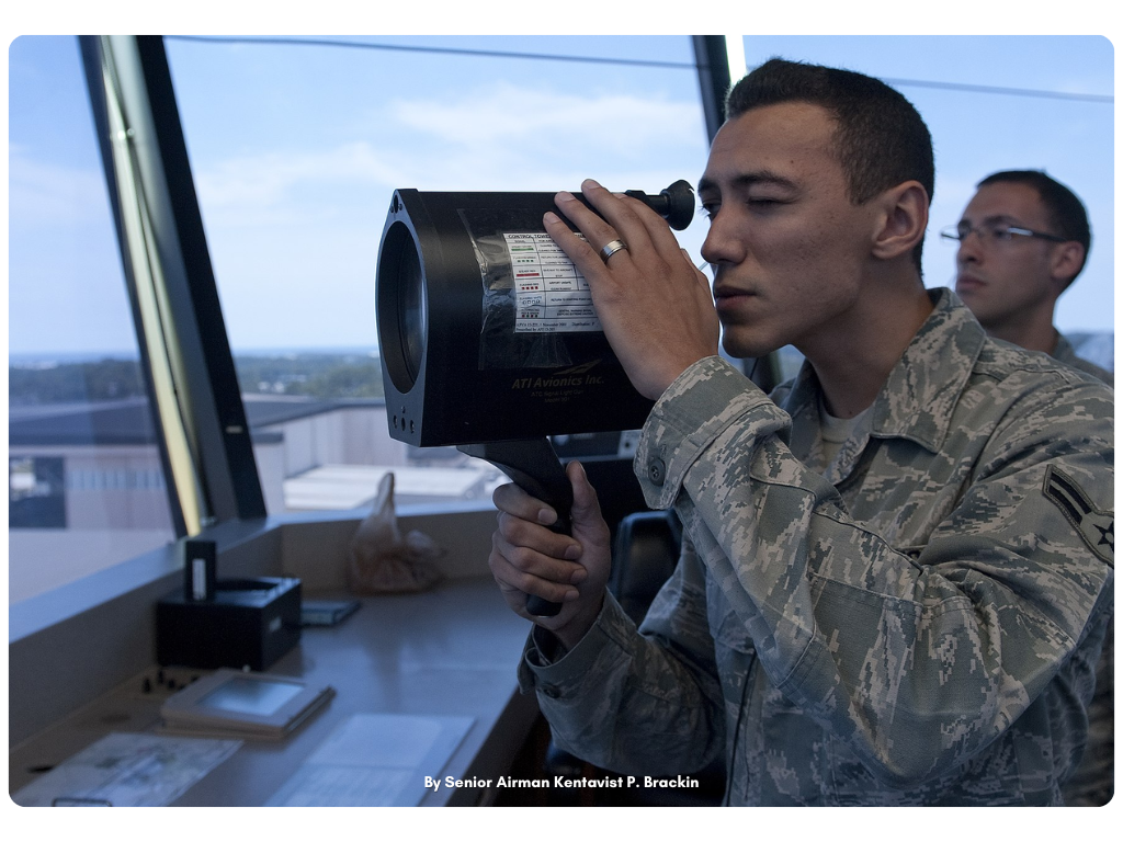 Airman 1st Class Patrick Ayoung Using Light Gun - By Senior Airman Kentavist P Brackin