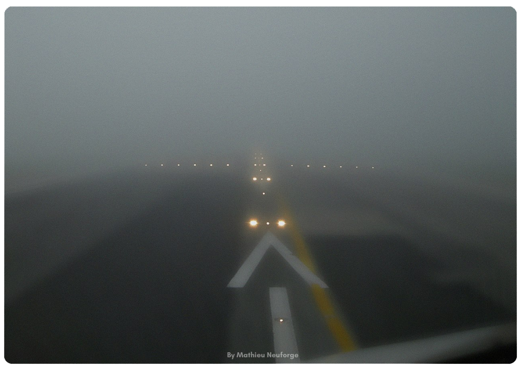 A close up of a runway with low visibility or a low runway visual range rvr and runway lights