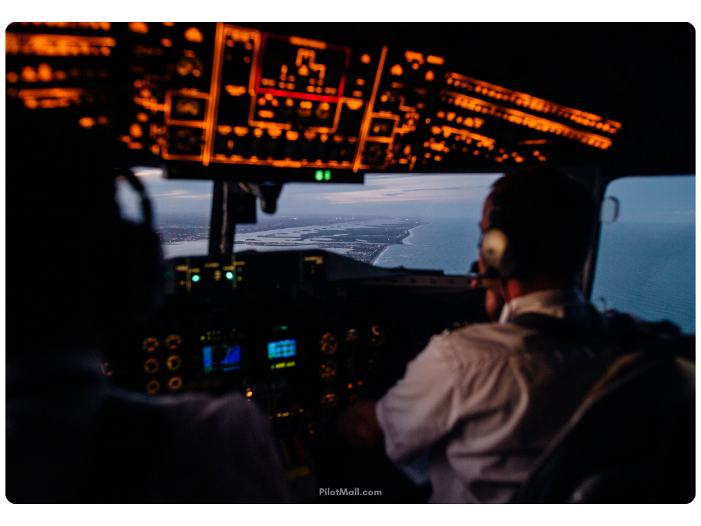 Pilots in the Cockpit During Evening - Pilot Mall