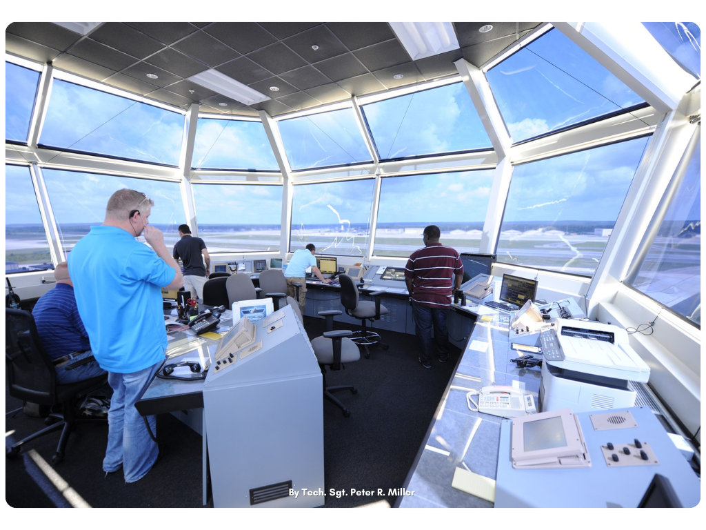 Air traffic controllers communicating with aircraft from the tower