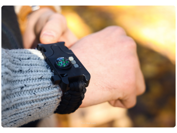 close up of a mans wrist with a compass