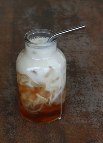 Glass container of iced milk tea