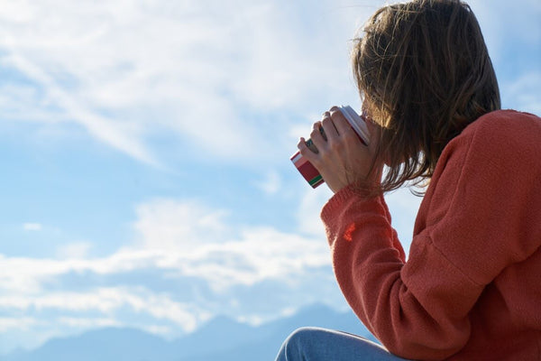 Woman Drinking Tea To Go