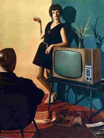 Women holding tea next to old tv