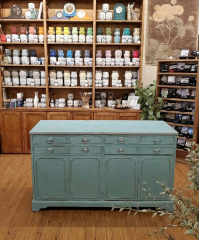 A fully painted buffet after applying the second layer of chalk paint.