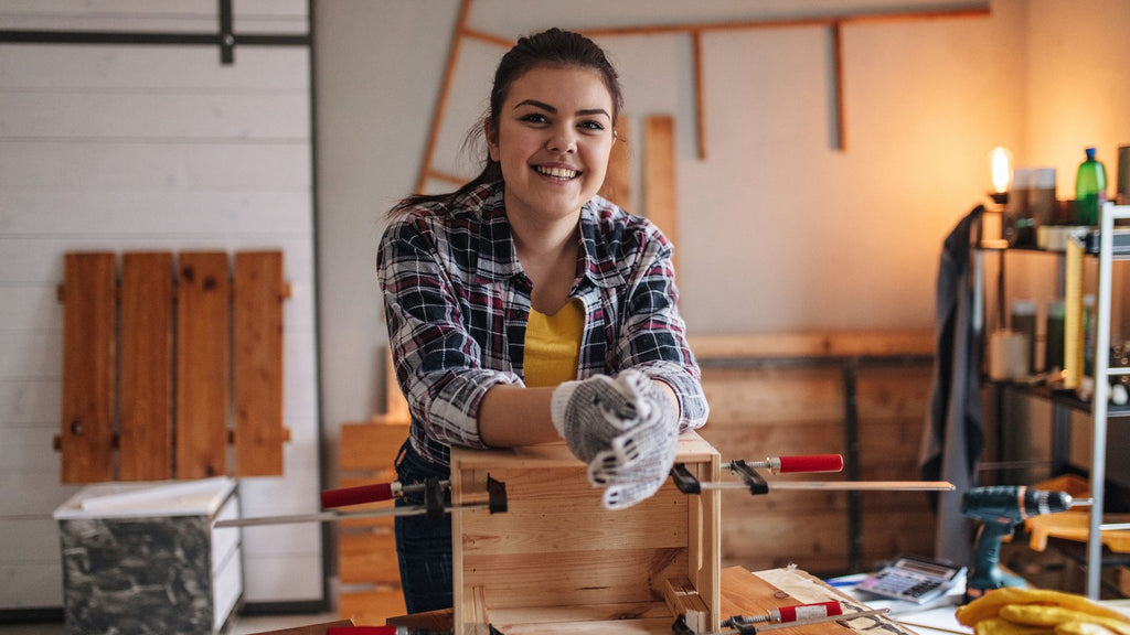 A person fixing some old furniture.