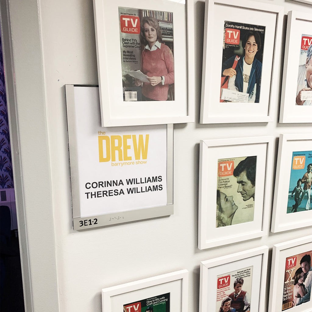 A sign with Corinna and Theresa's names on the door to the greenroom at The Drew Barrymore Show