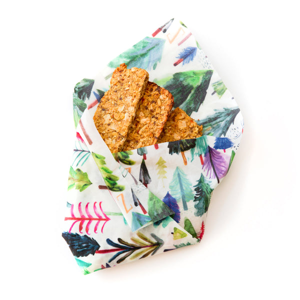 snack bars bundled in a white and rainbow tree print Z Wrap; the name of the design is Wild Wanderers