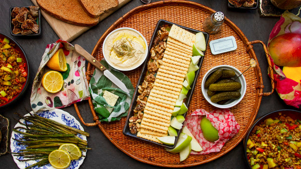 A spread of food laid out for a tapas-style meal, with several colorful Z Wraps doing their thing among the assorted vittles