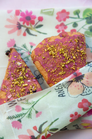 2 frosted scones with crushed pistachios, tucked into a Bees Love These print Z Wrap