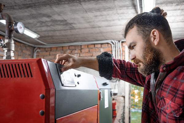 Professional HVAC technician servicing a furnace