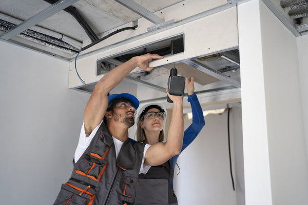 Professional installing a duct connector