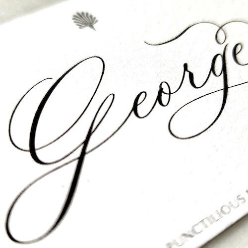 close up detail of The Punctilious Mr. P's Place Card Co. 'Calliope Script' Font digitally printed on the back of a place card