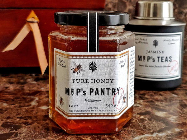 jar of mr. p's pantry pure honey on brown marble counter top