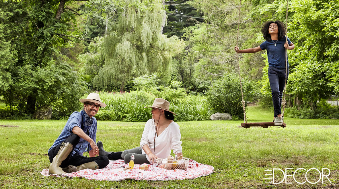 The Punctilious Mr. P's Place Card Co. | Martin Cooper & Karen Suen-Cooper in the garden with their son pax on the swing Elle Decor Magazine 2020