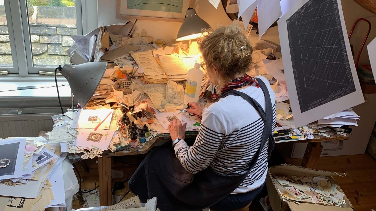 collage artist sarah v battle at home in her studio