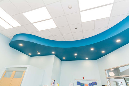 Light vinyl flooring, blue wall details, dark blue curved bulkhead. 