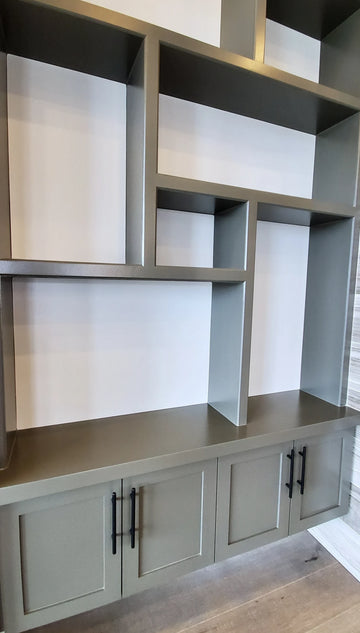 Dark grey abstract shelves with floating cabinets below.