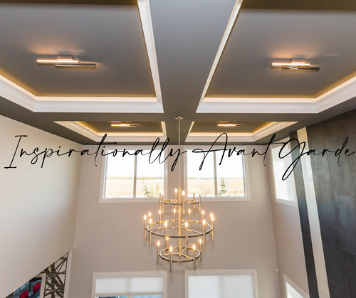 Grey coffered ceiling, white trim details, dark grey tile on right wall, and a large satin nickel chandelier.