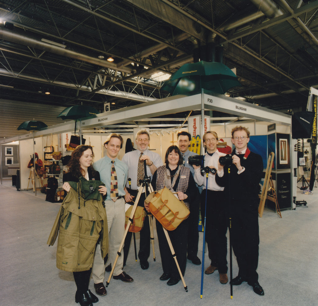 The Billingham stand at a photography show at the NEC, 1981. The photo features staff from Billingham and ‘CamCane’ which Billingham used to distribute. Ros Billingham is in the centre of the photo holding a Photo Eventer bag.