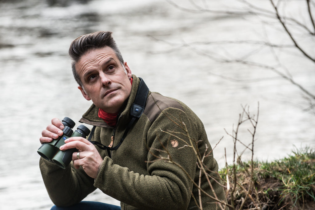 Nick with his binoculars. Photo by Juliette Mills Photography.