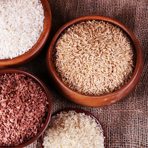 white, brown and black rice in a bowl