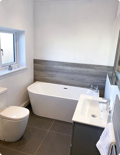 Image taken by an Unbeatable Bathrooms customer. Showcasing their family bathroom, which includes a Back-To-Wall Freestanding Bath, Close Coupled Toilet and Wall Hung Basin Vanity Unit.
