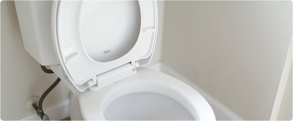 Image of a toilet with the toilet seat up.