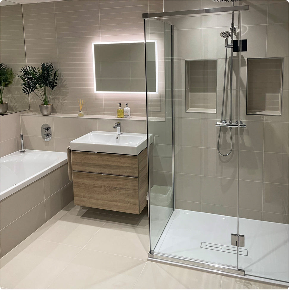 Image of a large bathroom, featuring a double ended bath, walk-in shower, vanity unit and mirror. 