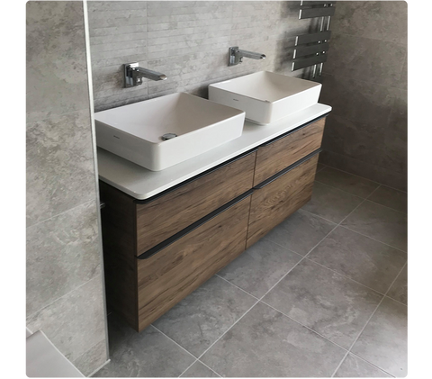 Unbeatable Bathrooms customer image of two countertop basins on top of a double wall-hung vanity unit in a dark oak finish.