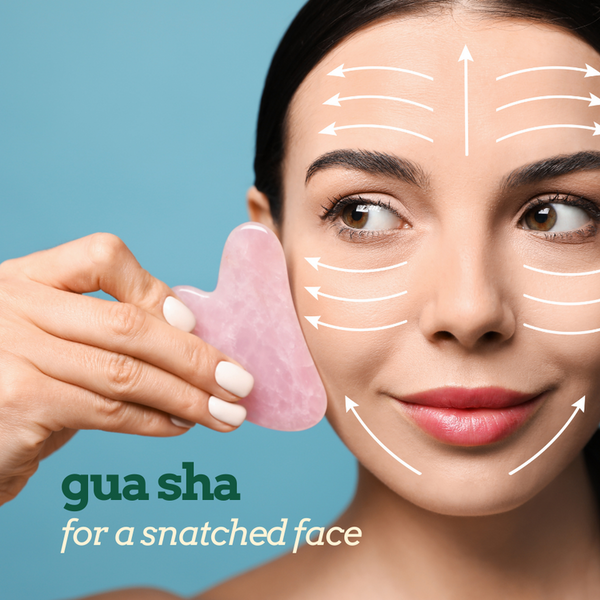 A woman shows Gua Sha techniques with an Earth Therapeutics Rose Quartz Facial Smoothing Tool