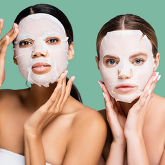 Two women wear facial sheet masks for Korean Beauty Glass Skin