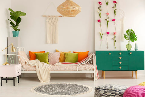 hanging flower garlands on wall as living room decor