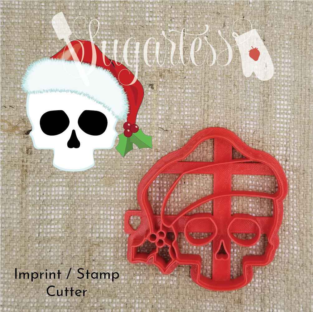 Sugartess custom imprint or stamp cookie cutter in shape of a skull wearing a Christmas hat.