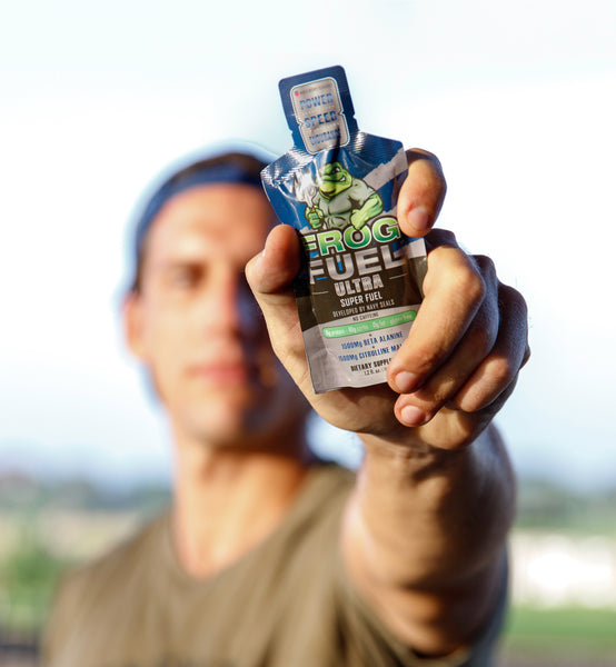Athlete showing Frog Fuel Ultra liquid protein shot to the camera