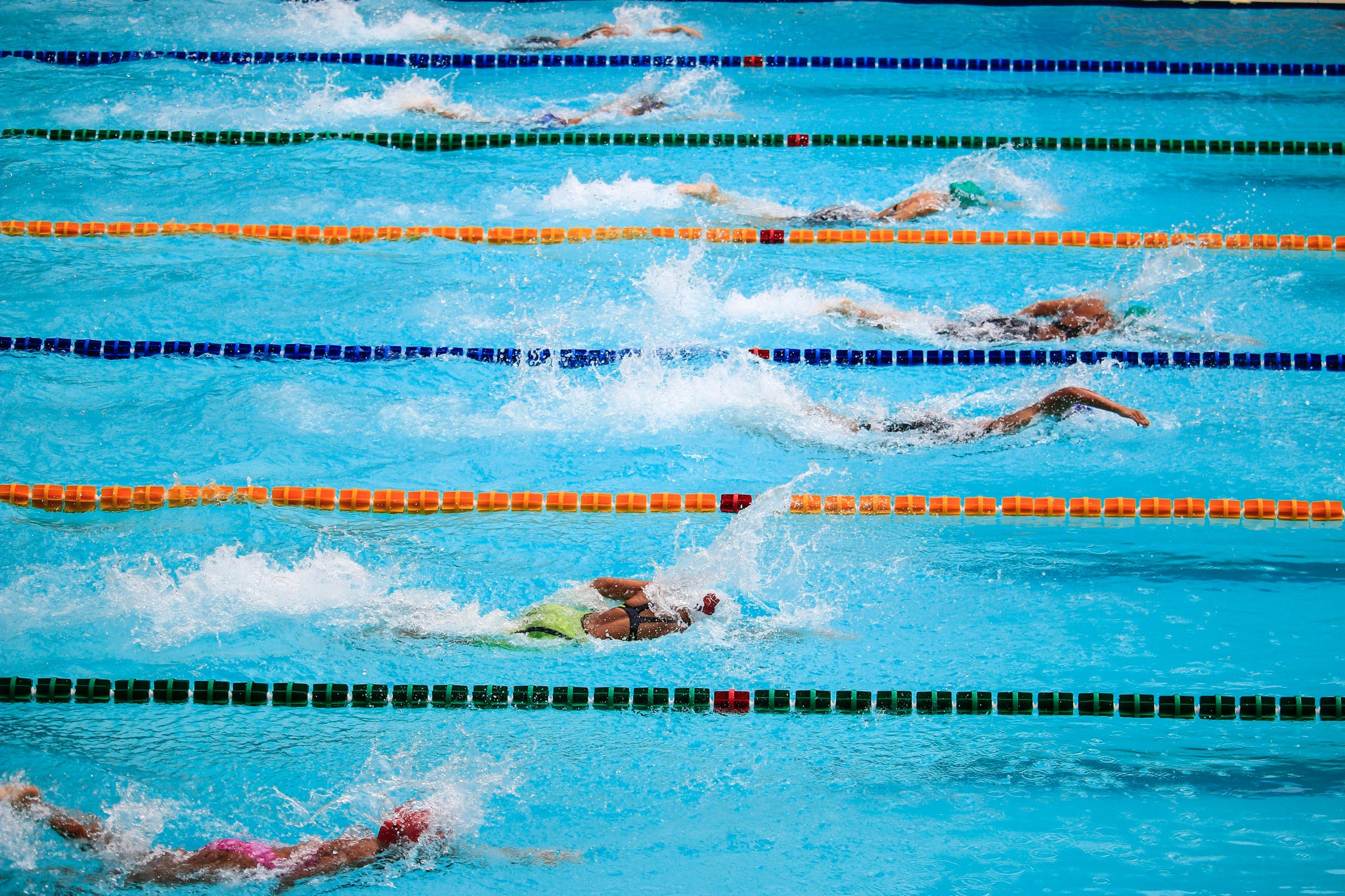 Athletes on a swimming workout as a solution to: “What can you do to prevent running injuries?”