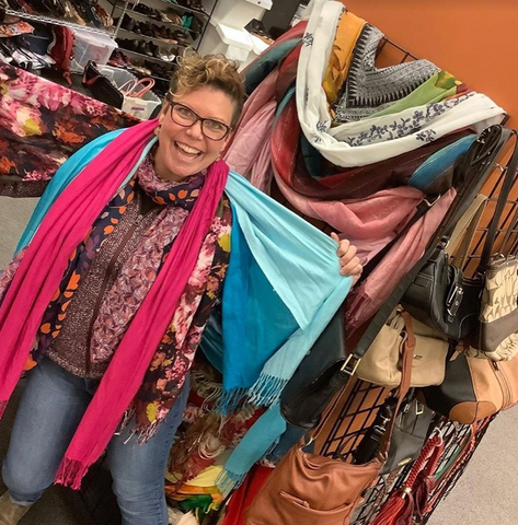 VIP customer trying on scarves at In Her Shoes