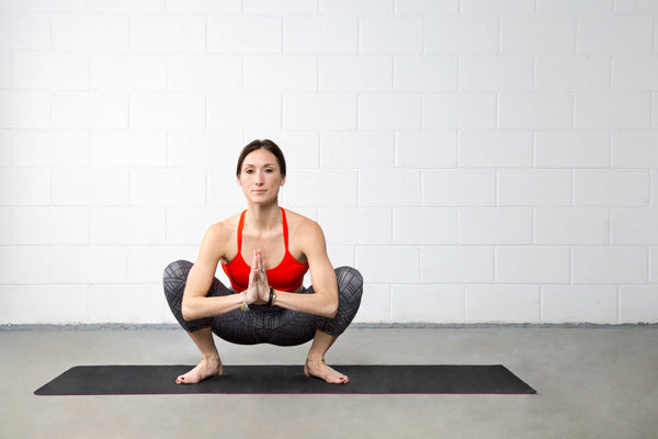 Chalnessa Eames doing a yoga squat