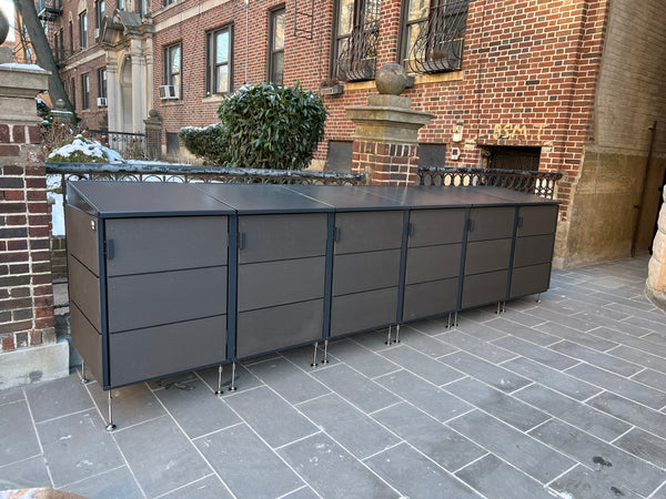 Modern trash enclosures and package lockers. Rats hate us.