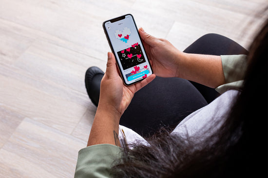 Woman creating a message on the Lovebox app