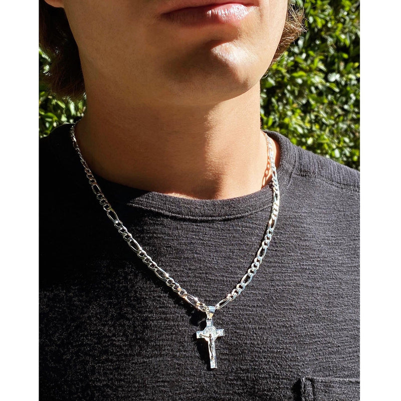 silver figaro chain with cross