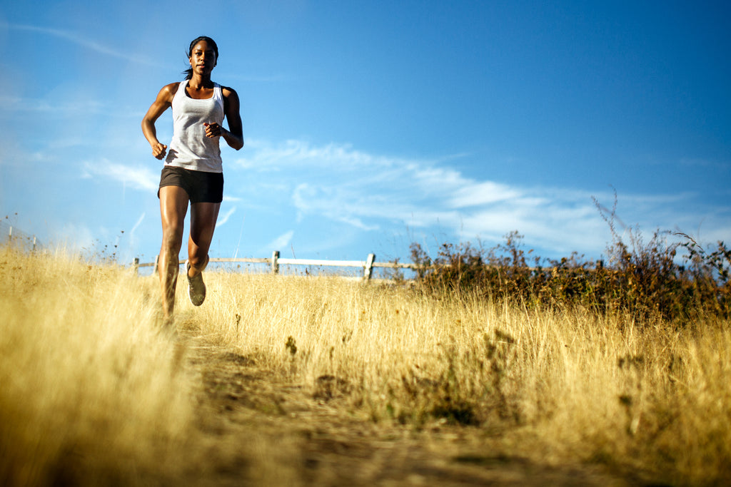 woman running in field - joint pain - turmeric - aceva mobility