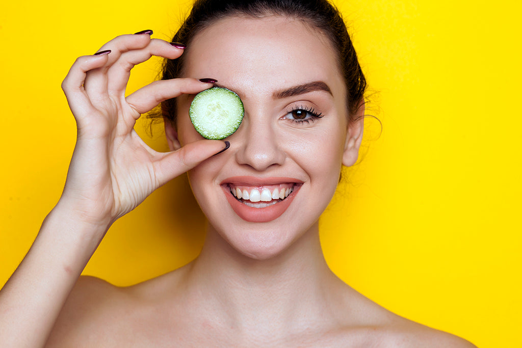 Woman holding cucumber slide to eyes - Allergy Relief - Itchy Eyes