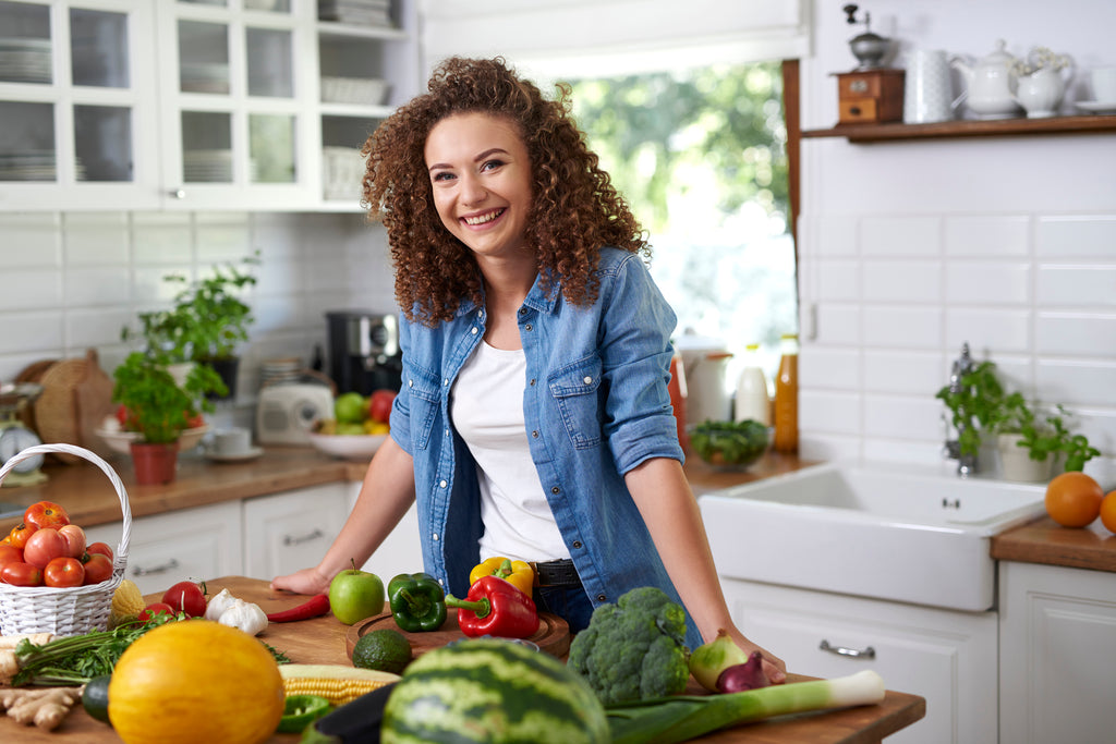 woman prepping food in kitchen - nutrition - nutrient pairings