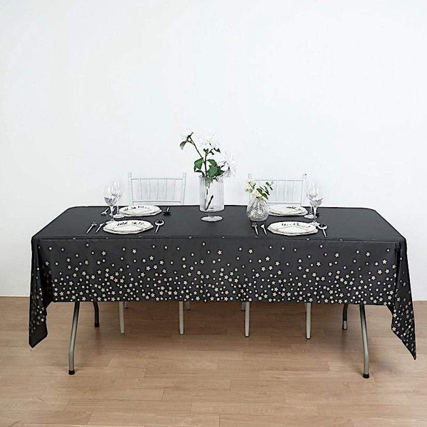 Premium AI Image  A black table with black balloons and a table with a  white table cloth.