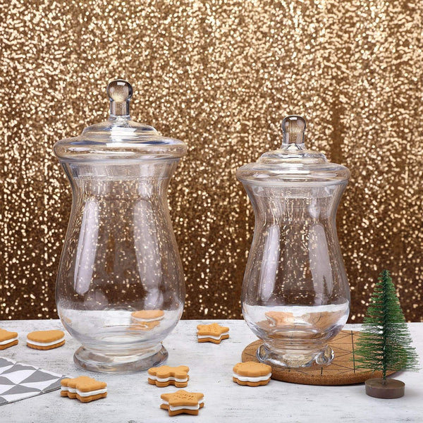 https://cdn.shopify.com/s/files/1/2789/7936/products/balsa-circle-favors-2-pcs-10-12-tall-clear-glass-apothecary-jars-with-lids-glas-jar09-clr-6951959625776_600x600.jpg?v=1630836061