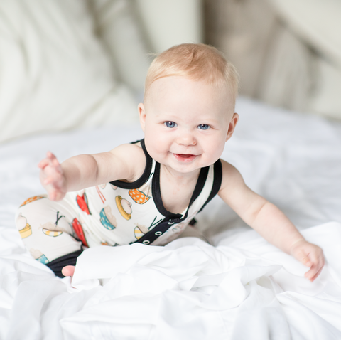 A baby wearing the Happy Dumpling Tank Romper