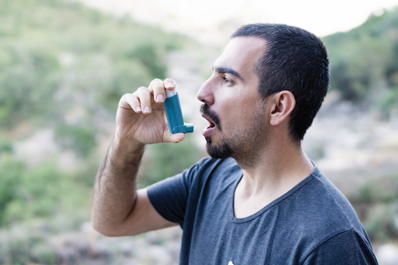 Man using an Asthma Inhaler