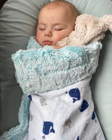 Baby swaddled in Minky blanket from Kalin Marie