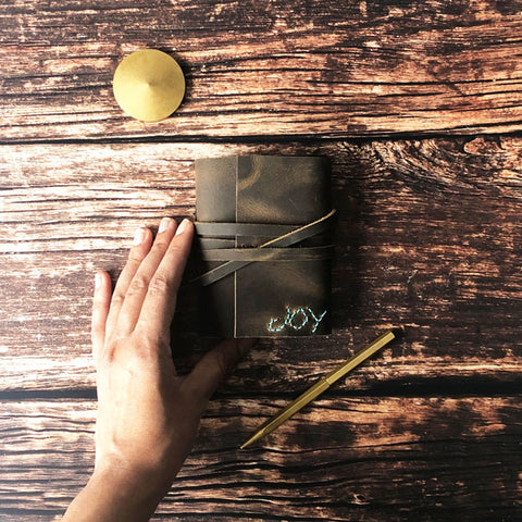 Small leather journal with handstitched Joy